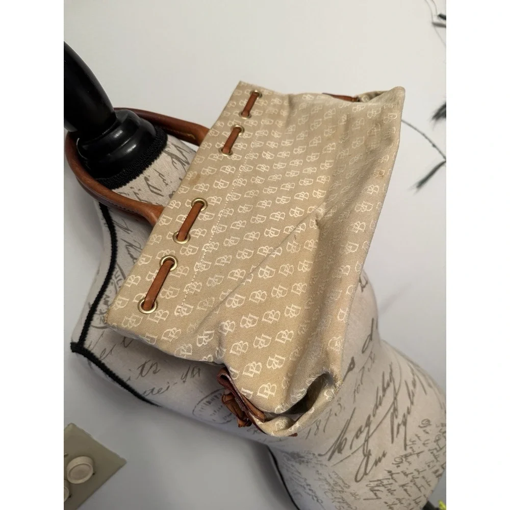 Dooney and Bourke Beige Canvas and Leather Signature Tassel Tote Handbag‎